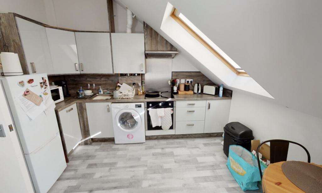 Bright and functional kitchen with ample counte...