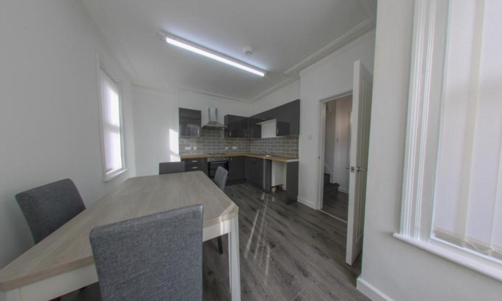 Modern kitchen area with a bright and airy atmo...