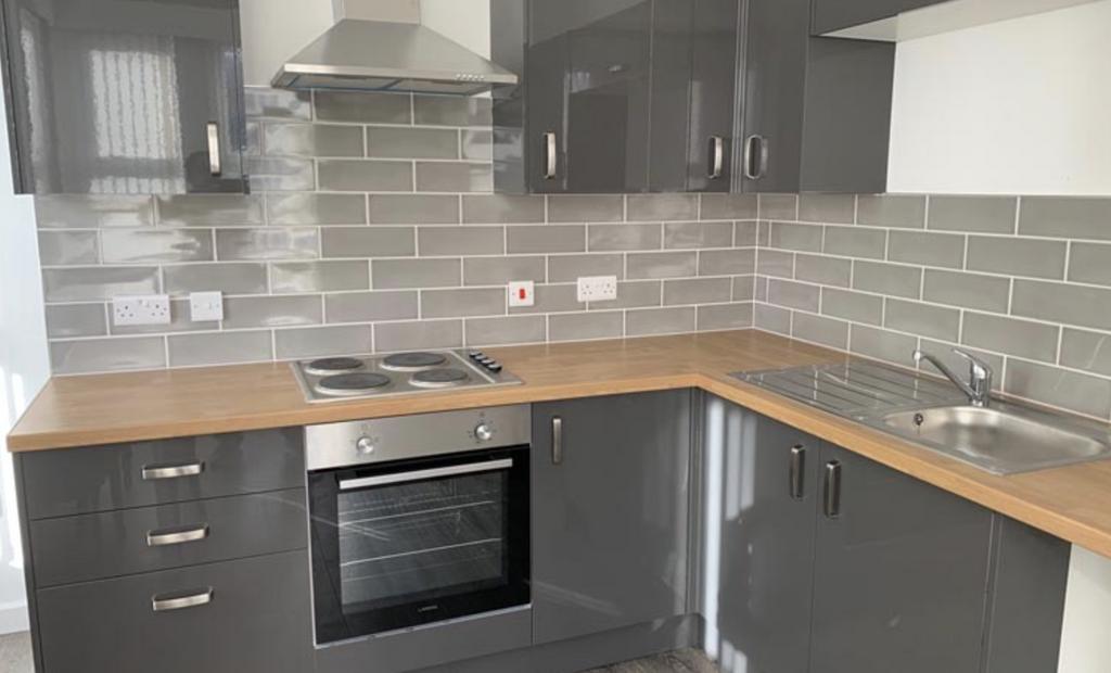 Modern and well-maintained kitchen area with sl...