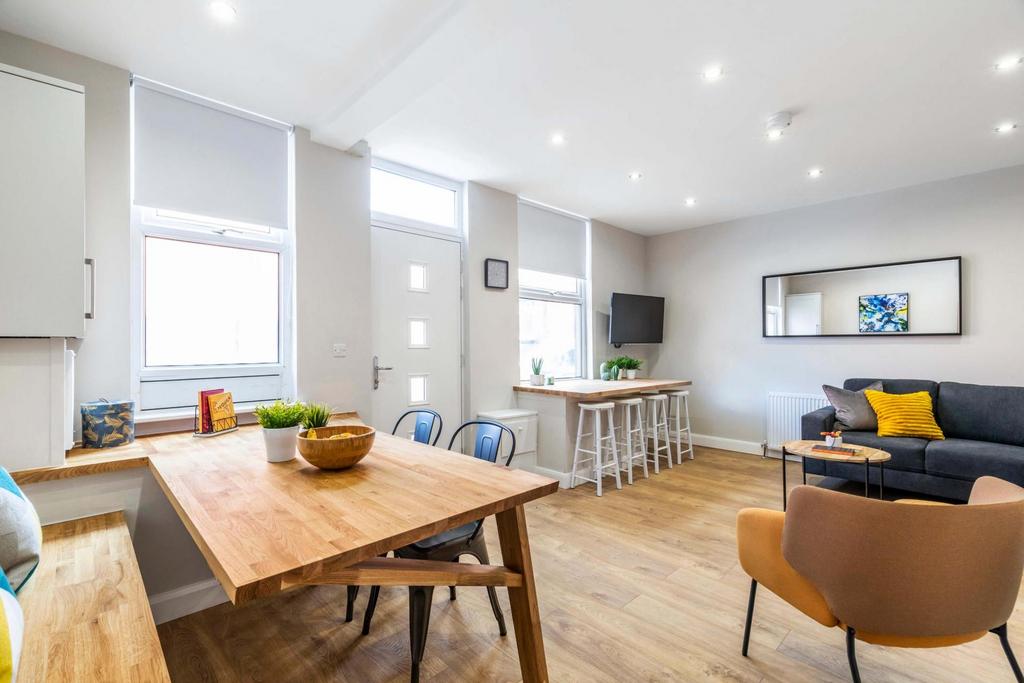 Bright, spacious living room with large windows...