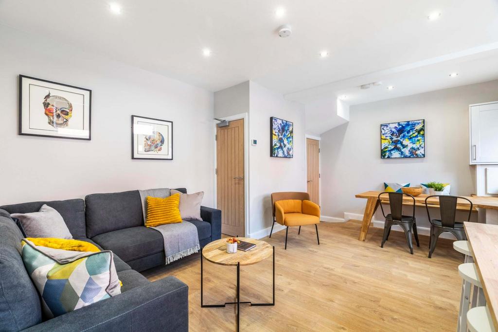 Spacious and well-lit contemporary living room ...