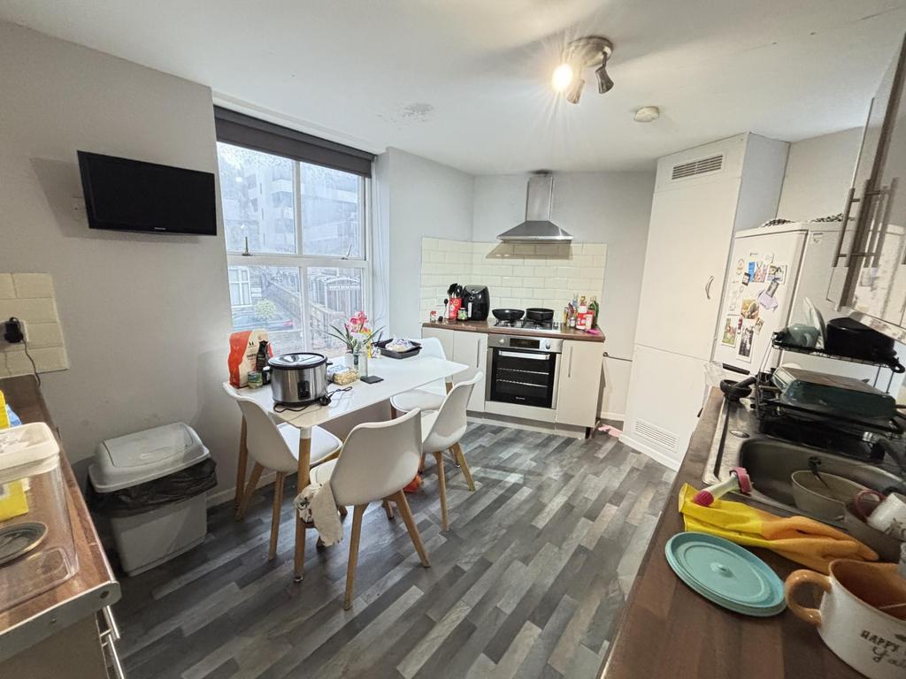 A modern and tidy kitchen space featuring a cen...