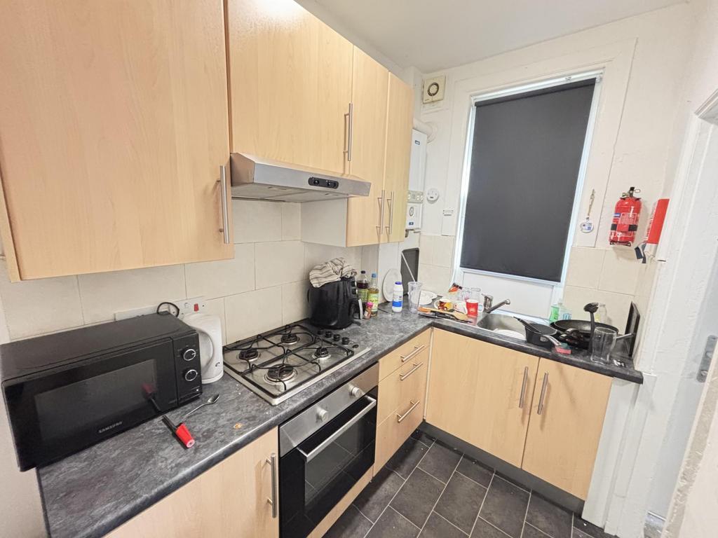 A modern, well-maintained kitchen with wooden c...