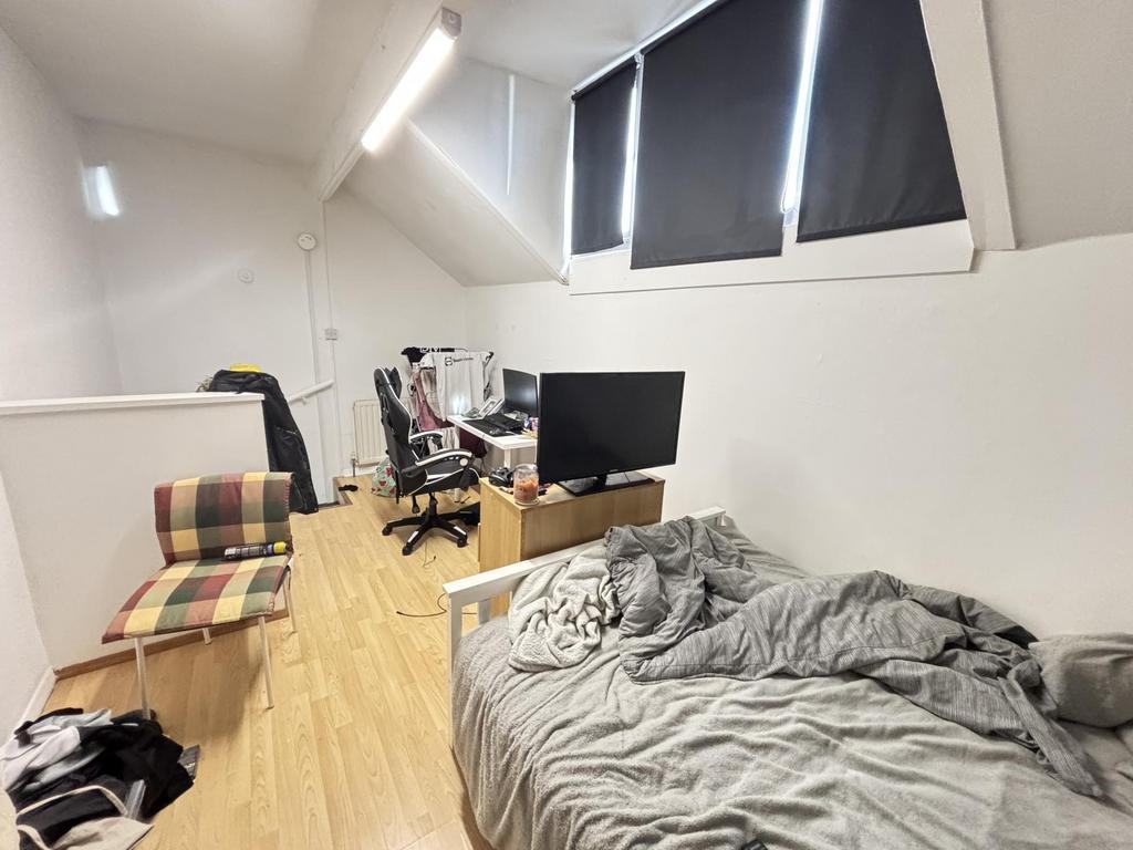 A cozy and functional living area featuring a c...