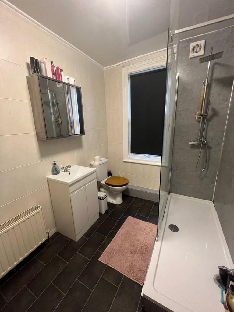 A clean and functional bathroom with a modern s...