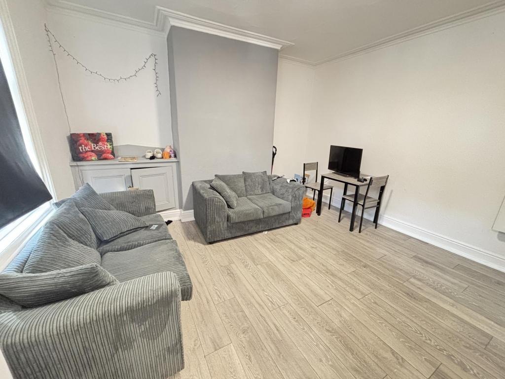 A spacious and well-maintained living room feat...