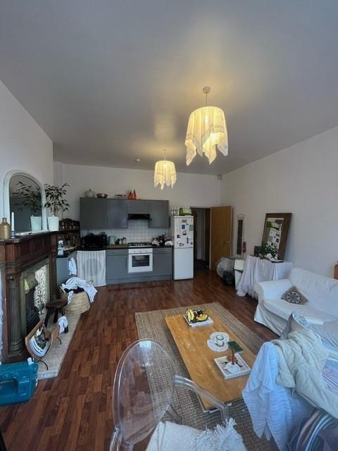 Bright and spacious living room with natural li...