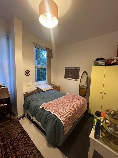 A cozy double bedroom featuring a comfortable b...