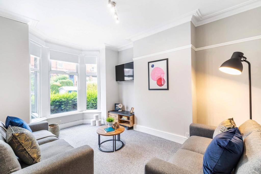 Bright and welcoming living room with large win...