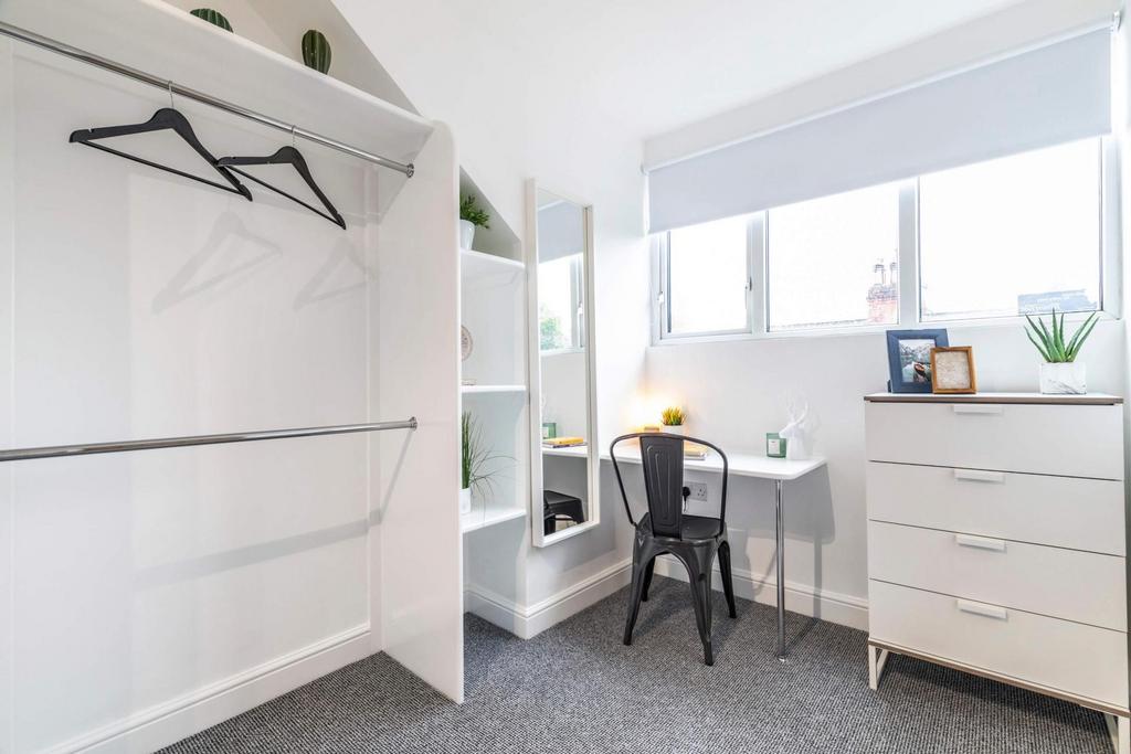 Bright and well-maintained bedroom featuring a ...