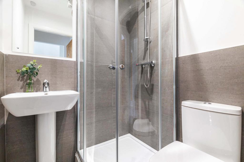 A modern, well-maintained bathroom featuring a ...