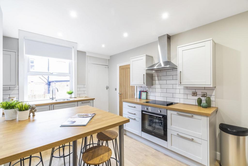 Bright and modern kitchen with ample natural li...