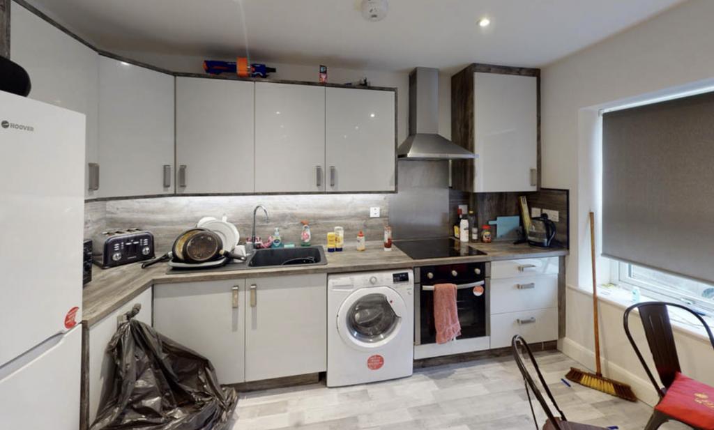A functional kitchen area with essential applia...