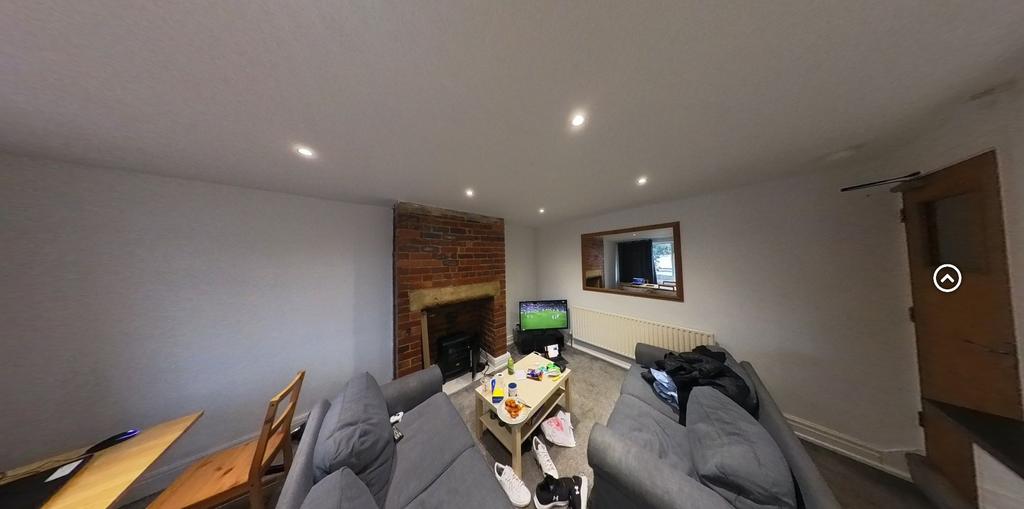 A spacious and inviting living room with modern...