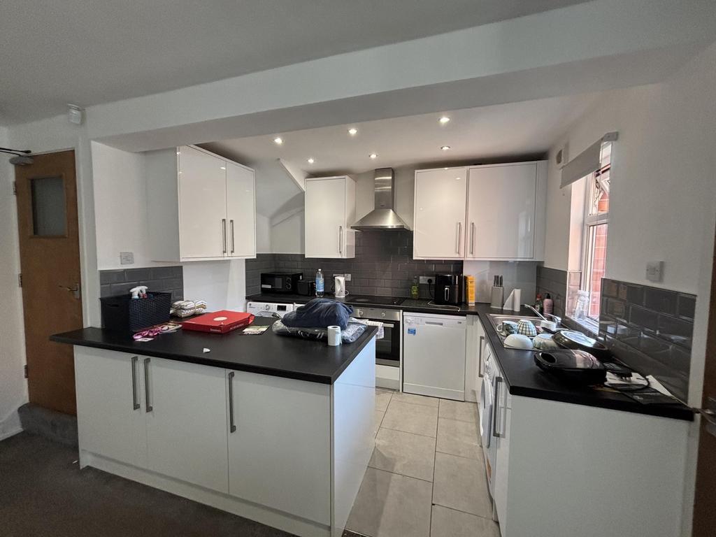 A modern, well-lit kitchen with ample workspace...