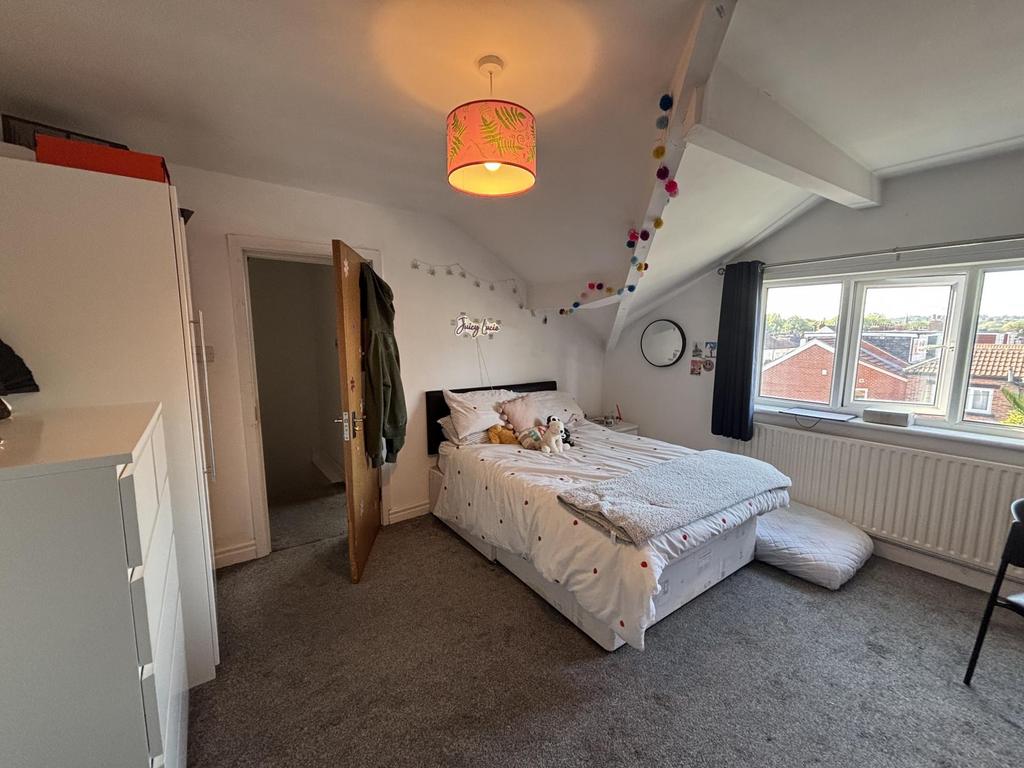 Bright and inviting double bedroom featuring a ...
