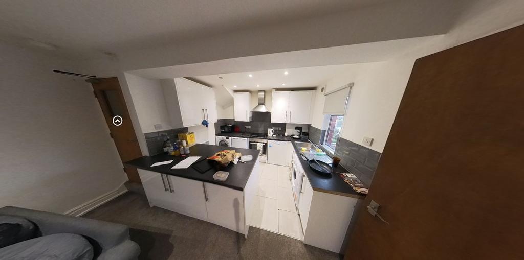 A spacious and modern living room with ample na...