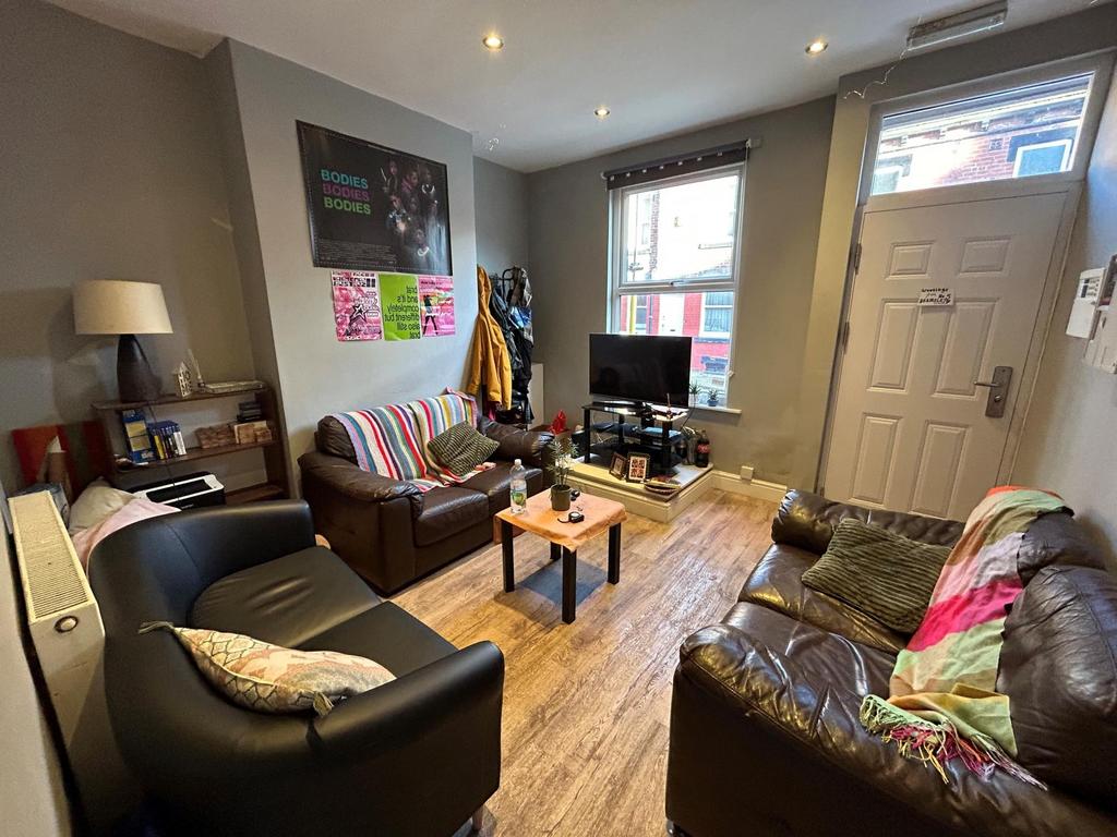 A bright and inviting living room with comforta...