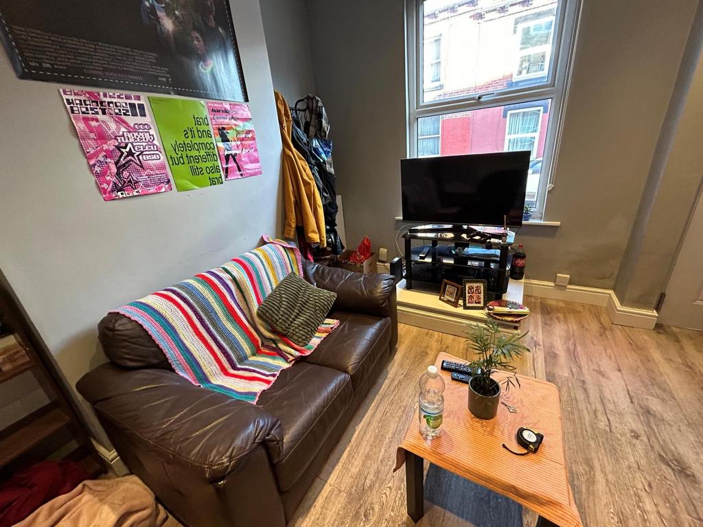 A cozy living room featuring a comfortable sofa...