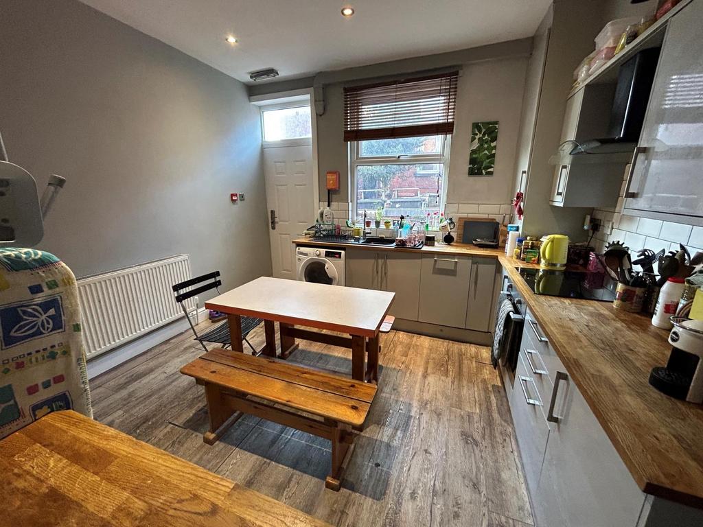 Bright and well-maintained kitchen with a cozy ...