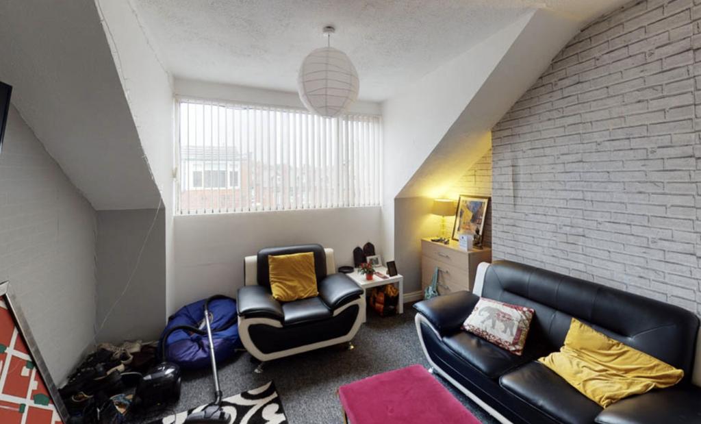 A modern, well-lit living room featuring contem...