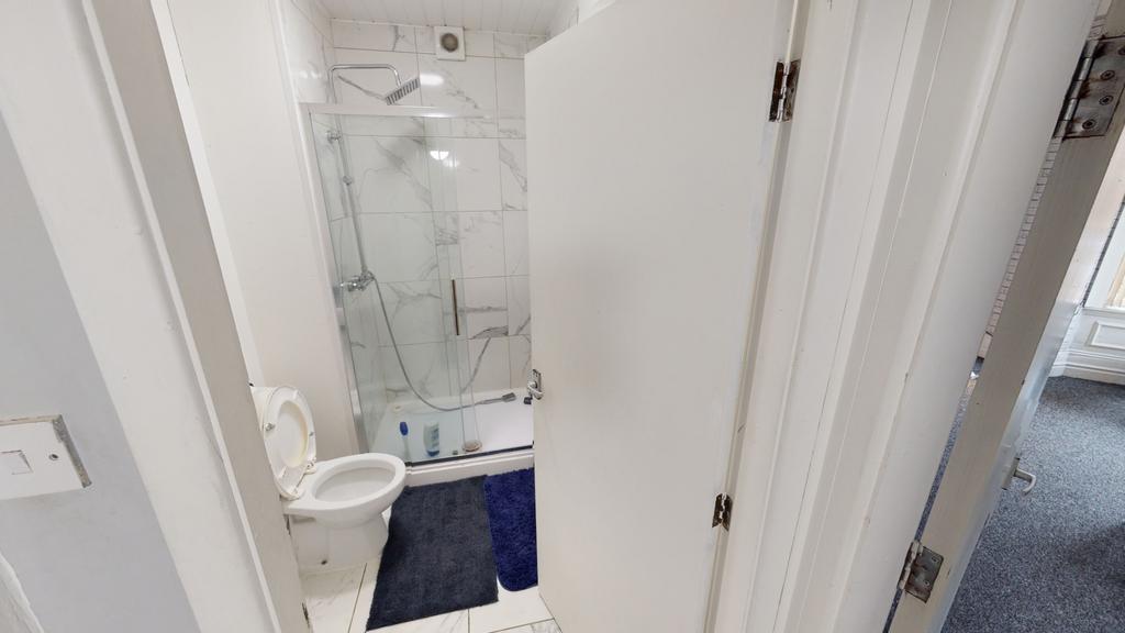 A clean and well-maintained bathroom with a sho...