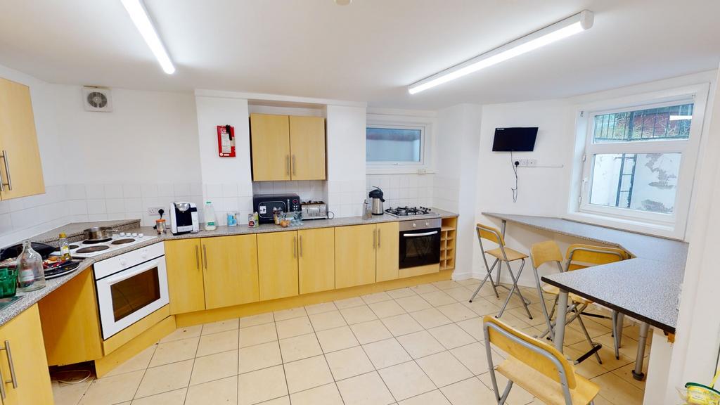Bright and modern kitchen with ample natural li...