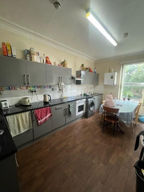 Bright and functional kitchen with ample counte...
