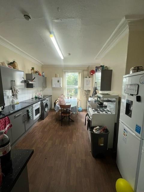 A bright and spacious living room with ample na...
