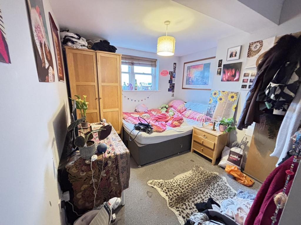 A cozy and well-decorated bedroom filled with v...