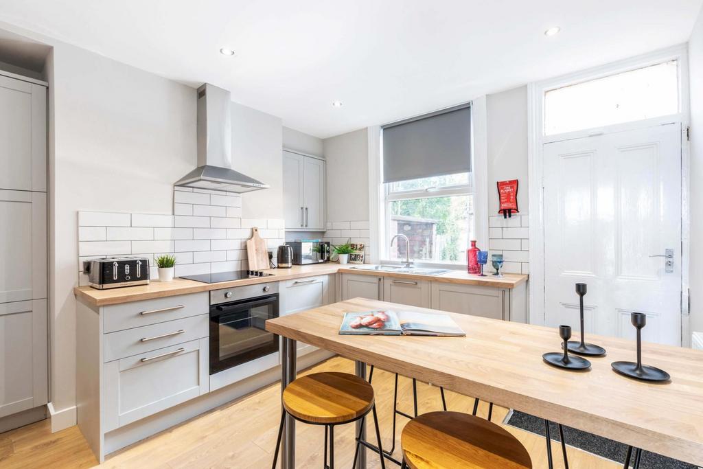 Bright and modern kitchen with ample natural li...