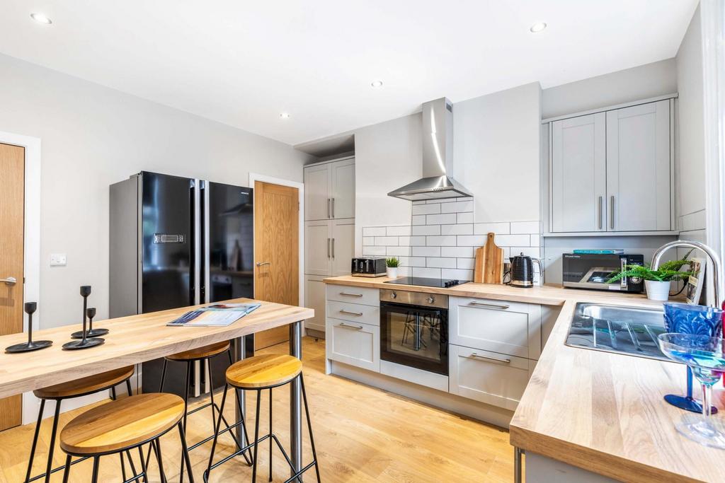 Bright and modern kitchen with ample natural li...