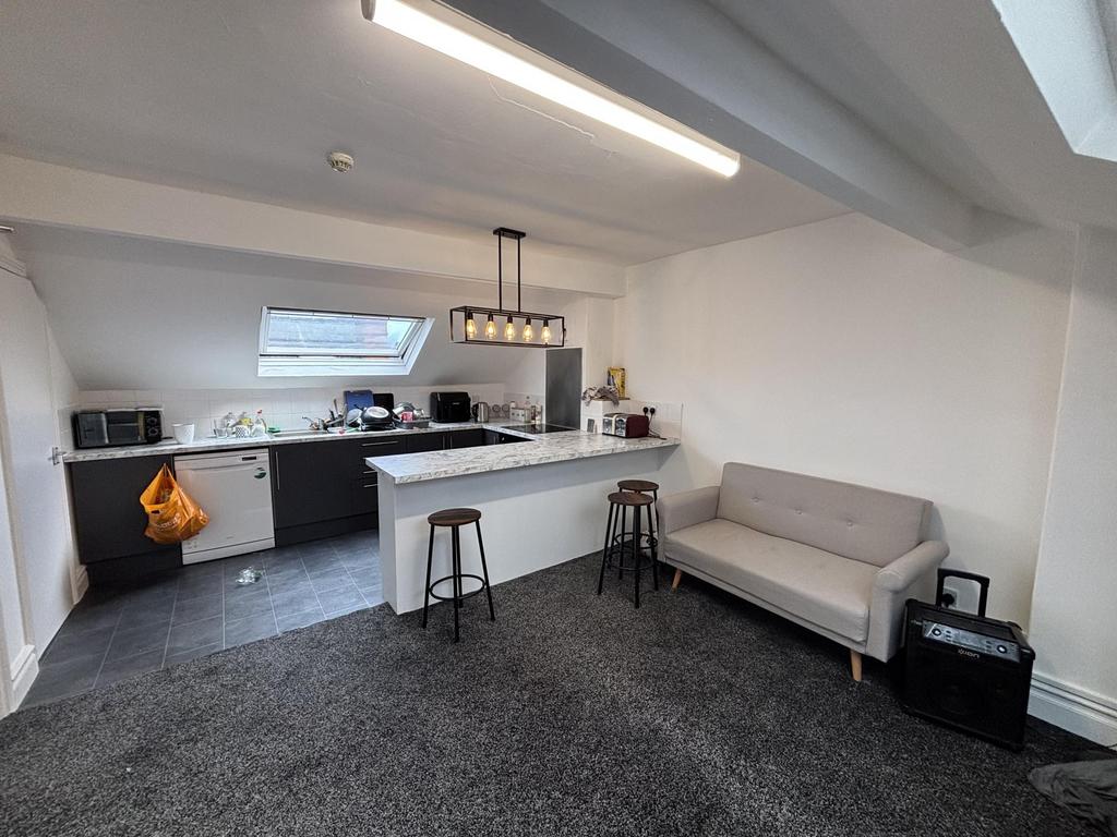 A bright and modern living room featuring a com...