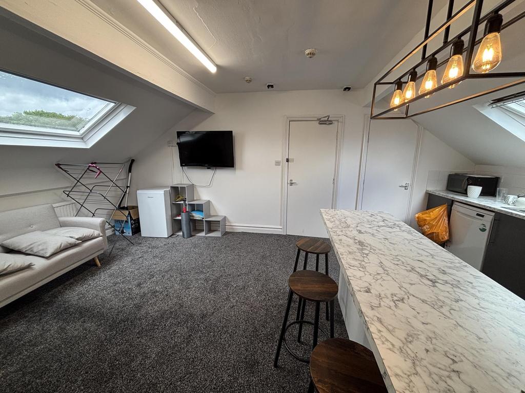 A spacious and modern living room with ample na...