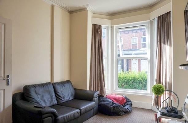 Bright and welcoming living room featuring a co...