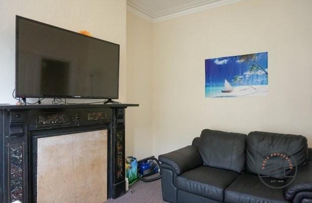A cozy and well-maintained living room featurin...