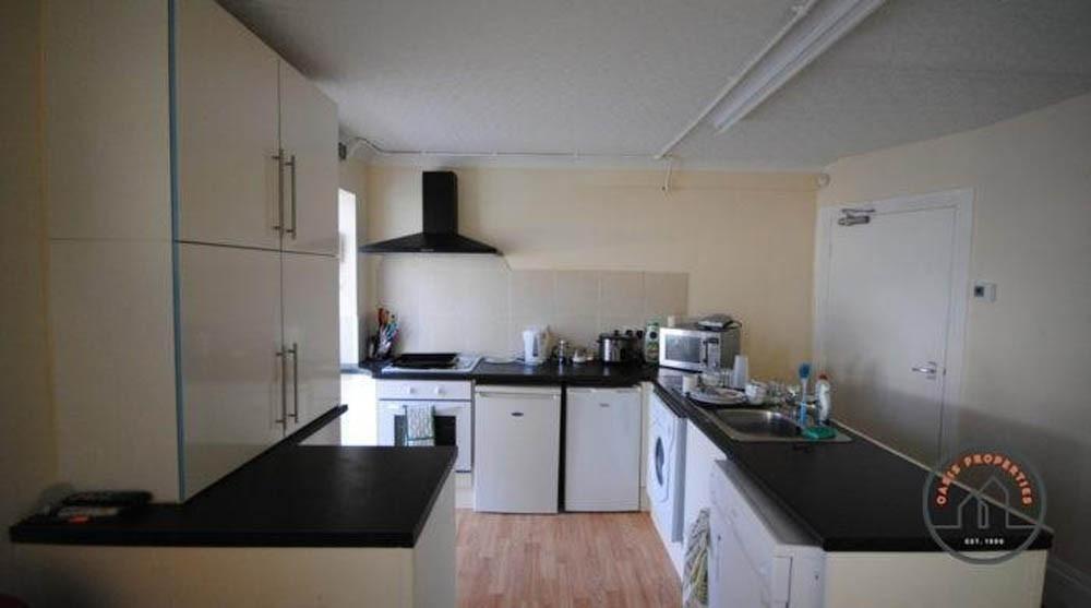 A modern, well-maintained kitchen featuring amp...