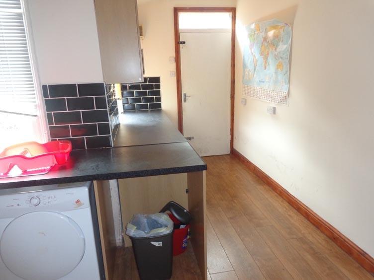 A compact, well-maintained kitchen area with es...