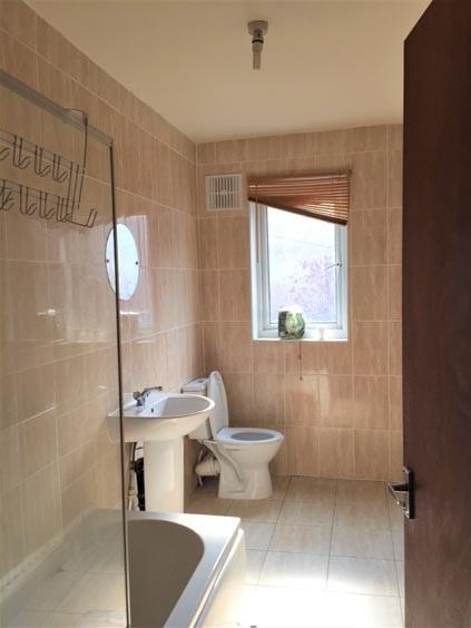 A clean and functional bathroom featuring a toi...