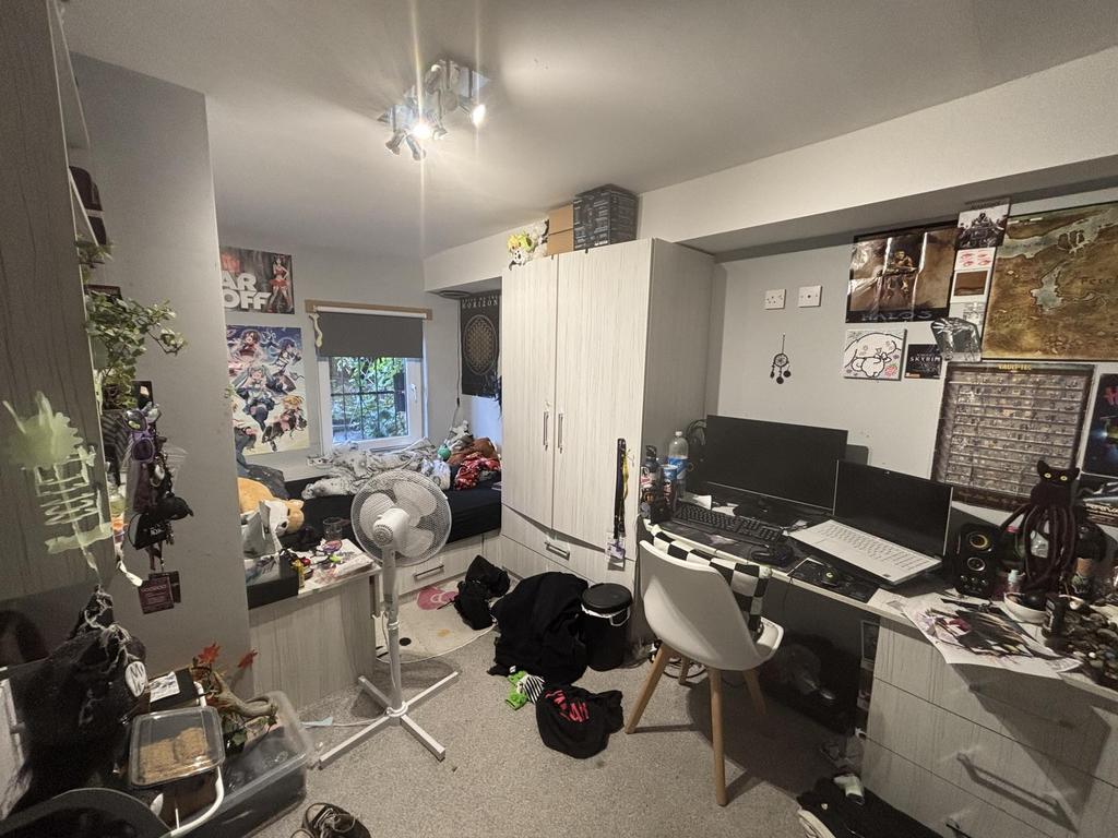 A cozy living room filled with personal items, ...