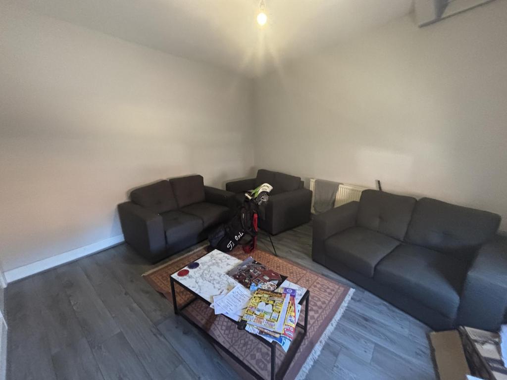 A spacious and well-maintained living room feat...