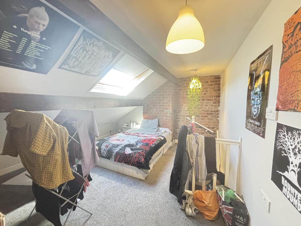 A bright and cozy bedroom with natural light fr...