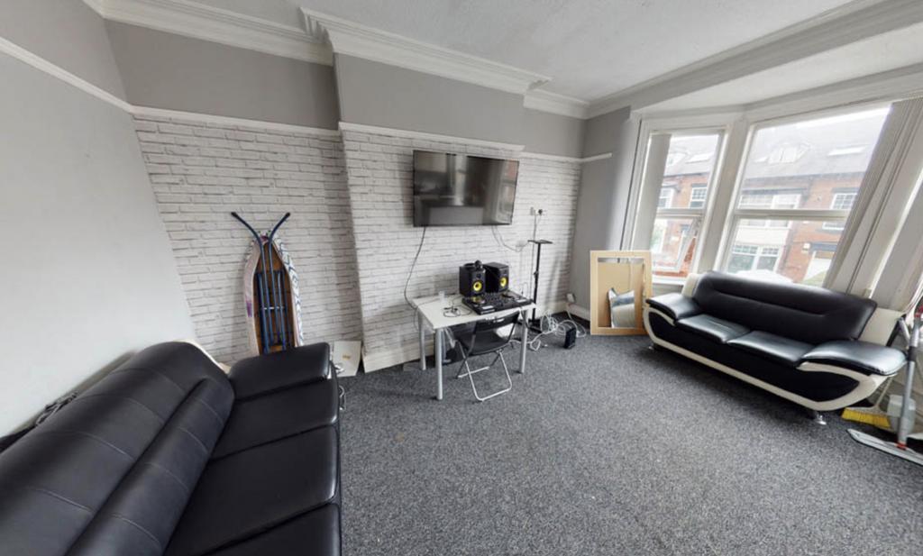 A bright and modern living room with large wind...
