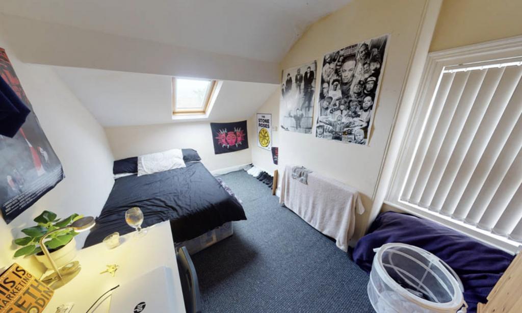 A well-maintained bedroom featuring a comfortab...