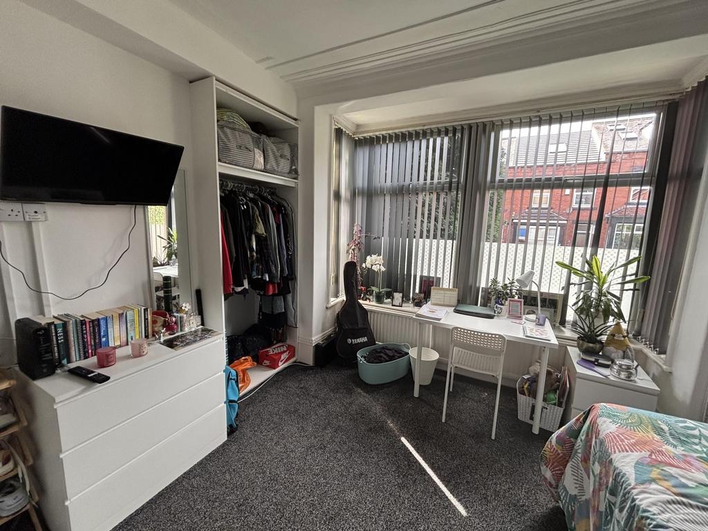 Bright and welcoming living room with large win...