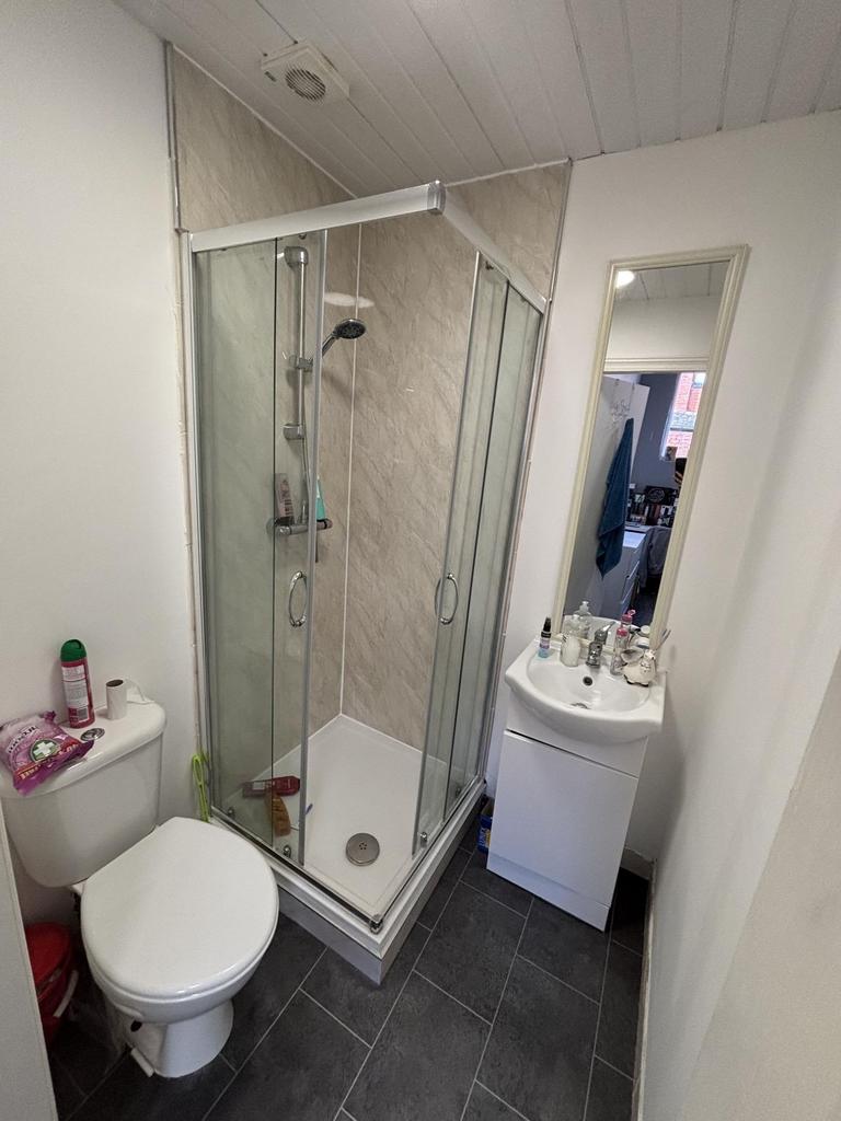 A clean and modern bathroom featuring a shower ...