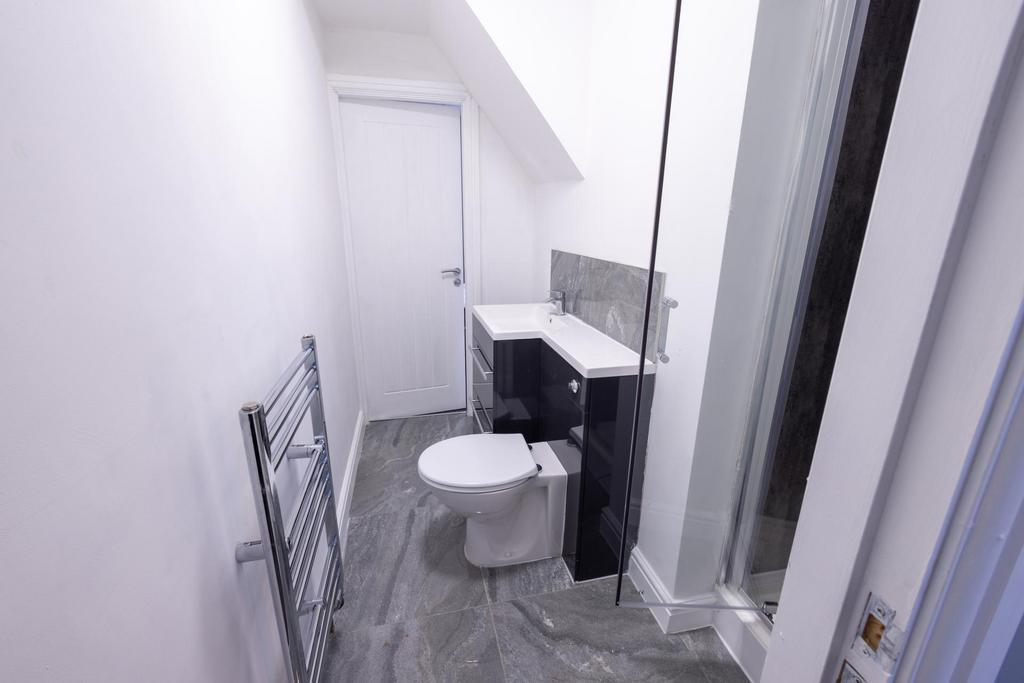 Bright modern bathroom with a walk-in shower, c...
