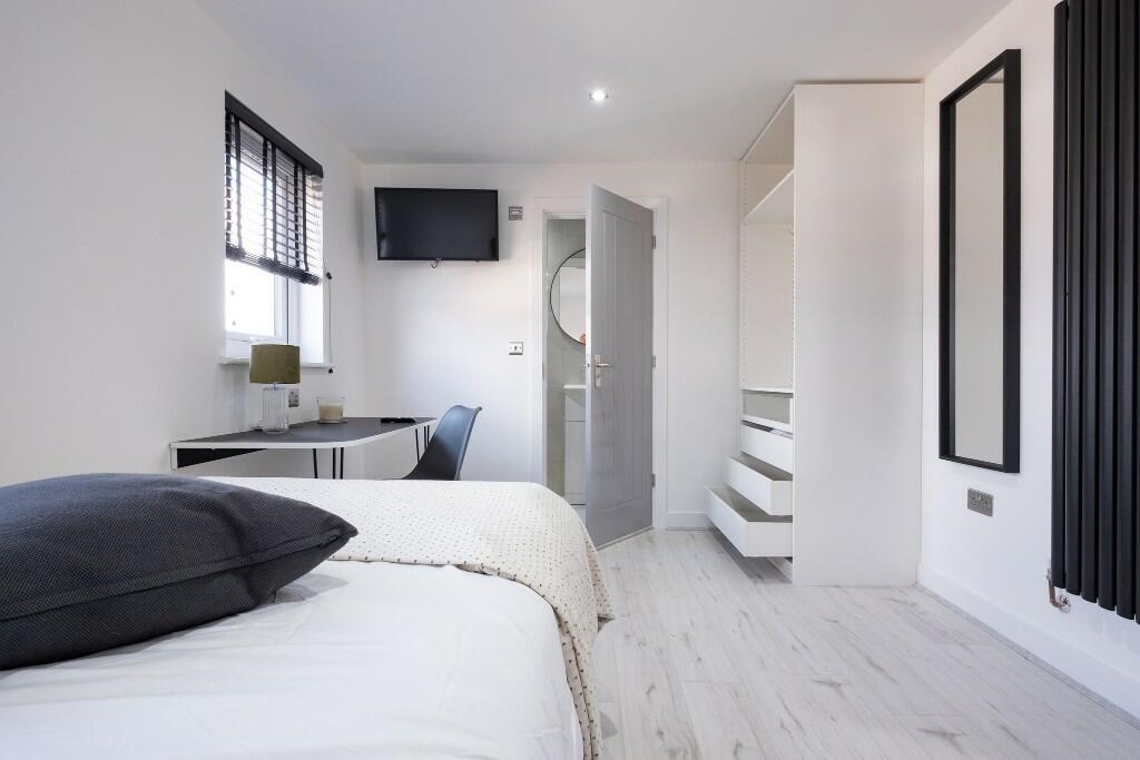 Bright and modern bathroom featuring a clean wh...