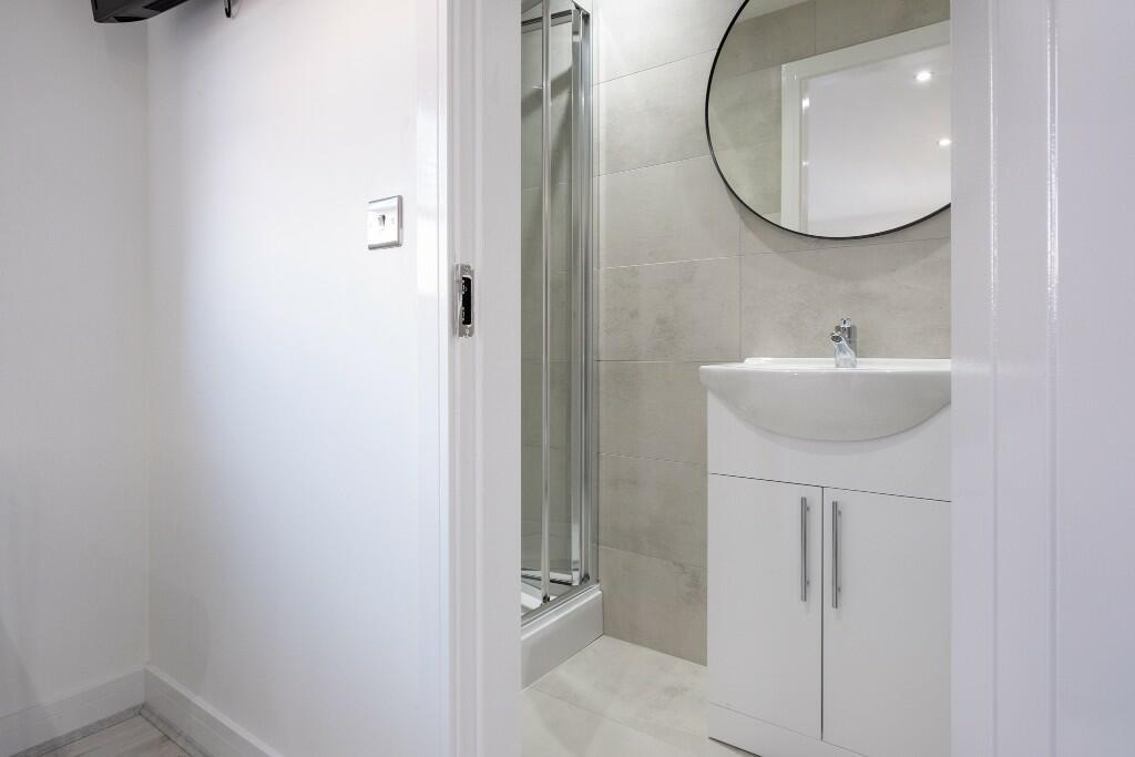 Bright and modern bathroom featuring a clean wh...