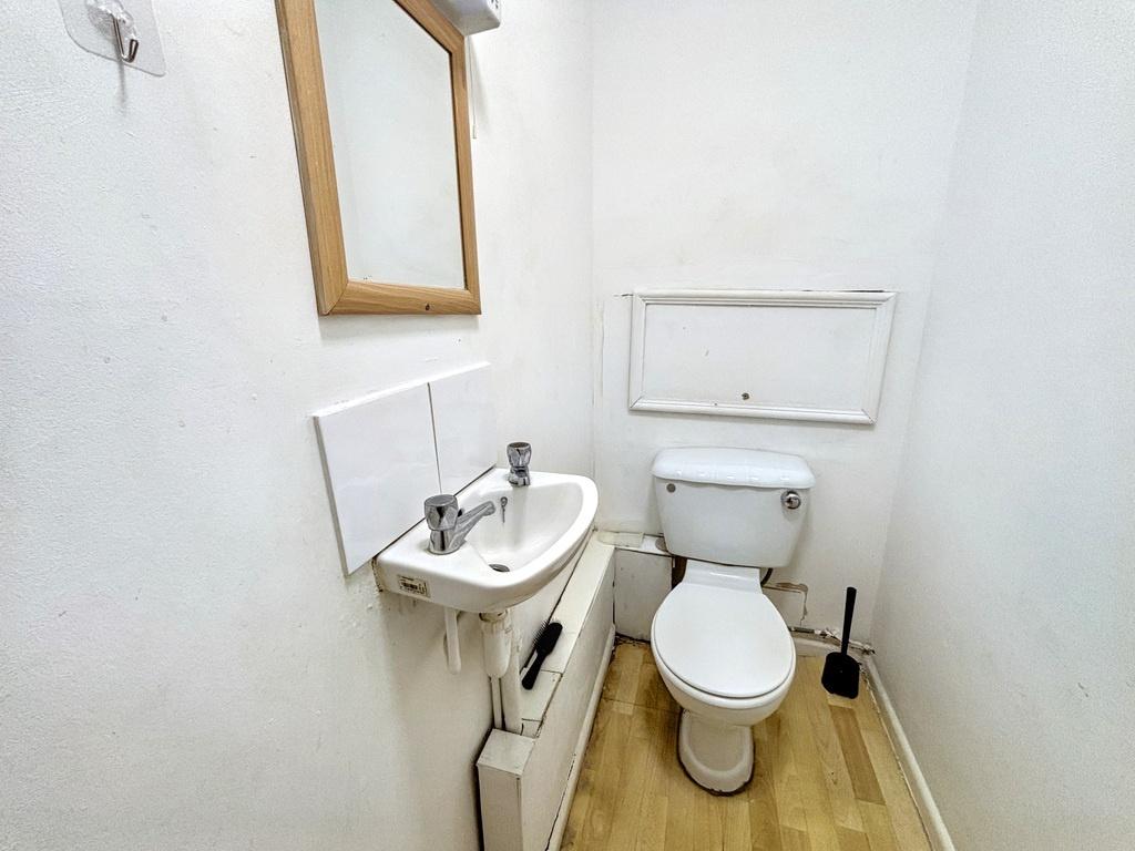 A clean and functional bathroom with a toilet a...